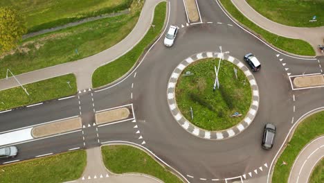 aerial view of cars driving in roundabout road at daytime