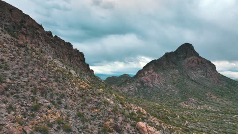 tucson mountain range against cloudscape sky in pima county, arizona, united states