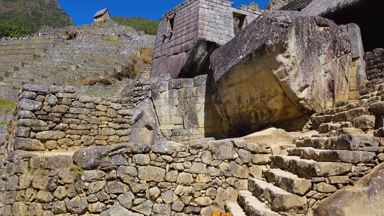 Incredible stonework of the Temple of the Sun at Machu Picchu, a masterpiece of Inca architecture. This footage highlights the religious importance and masterful construction of the sacred site