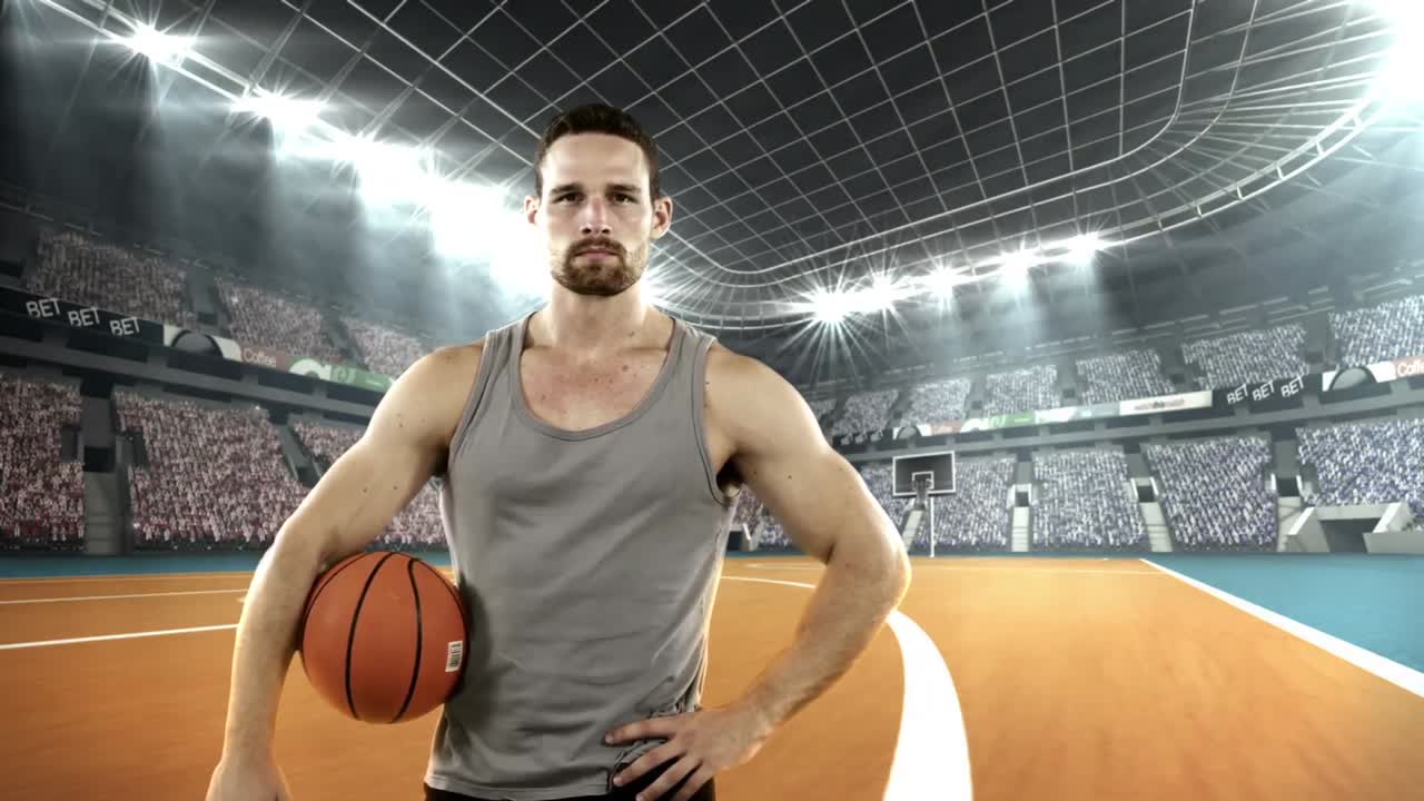 농구 선수가 농구와 함께 서 있습니다.