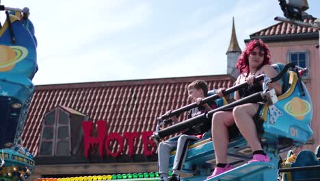 people enjoying a thrilling amusement park ride