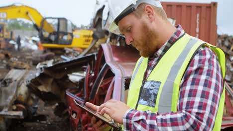 male worker using digital tablet in the junkyard 4k