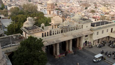 city view with artistic palace at lake shore at day video is taken at city palace, udaipur rajasthan india.