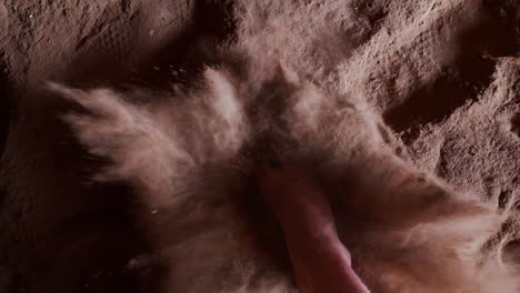 bare foot hits the sandy floor. slow motion