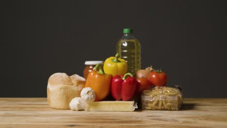 studio shot of basic food items on wooden surface and white background 3