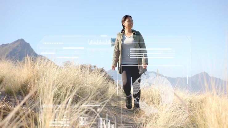 Midadult woman with pack starting hike on ridge, walking while nav HUD overlays shifting over frame
