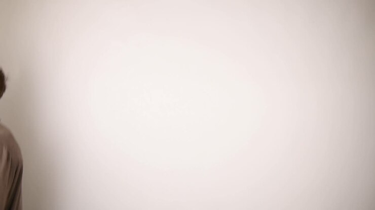 Man jumping from right to left on a white background