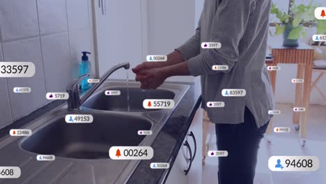 Animation-Von-Mediensymbolen-über-Einer-Kaukasischen-Frau,-Die-Sich-Die-Hände-Wäscht