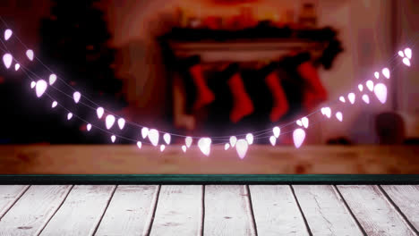glowing pink fairy light decoration hanging over textured wooden plank