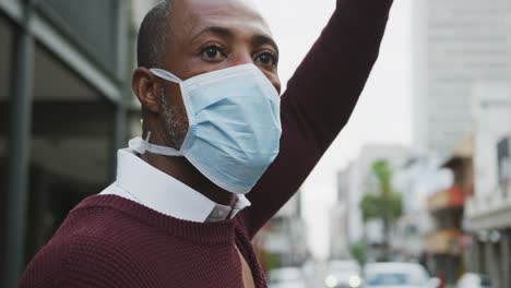 african american man on the go wearing coronavirus covid19 mask