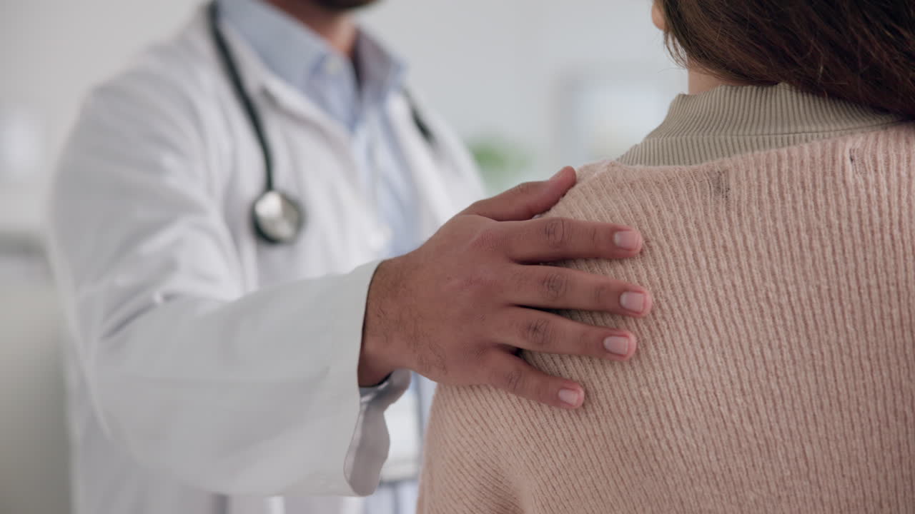 Doctor comforting patient