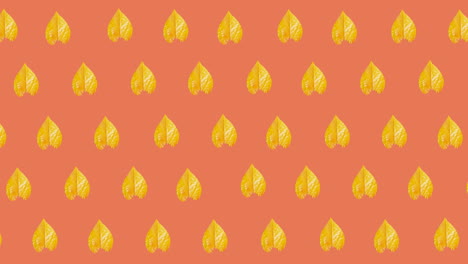 animación de múltiples hojas amarillas de otoño sobre un fondo naranja