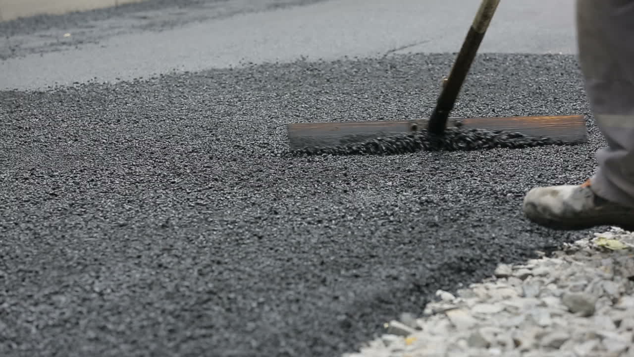 Construction workers during asphalting road works