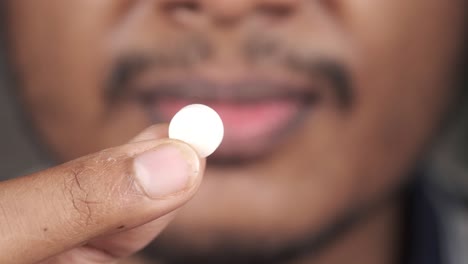 person holding a pill