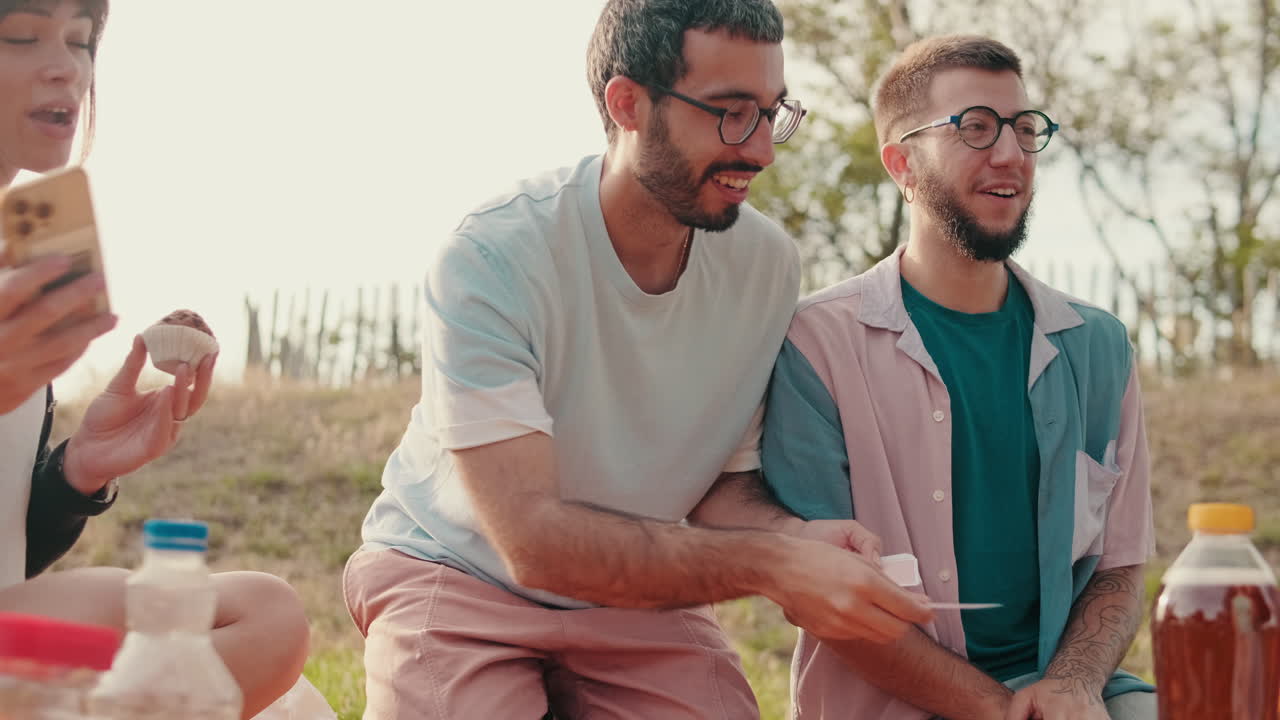 Friends Playing Cards at a Summer Picnic