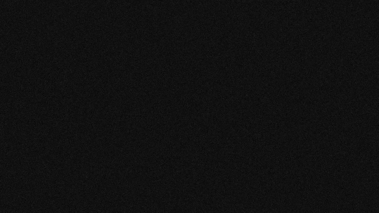 Animation of dark grey abstract noise specks moving fast on dark grey background
