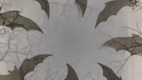 Animation-Von-Halloween-Graufledermäusen-Im-Kreis-Auf-Grauem-Hintergrund