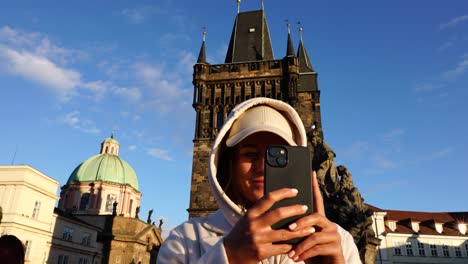 Girl-stand-near-Powder-tower-and-St