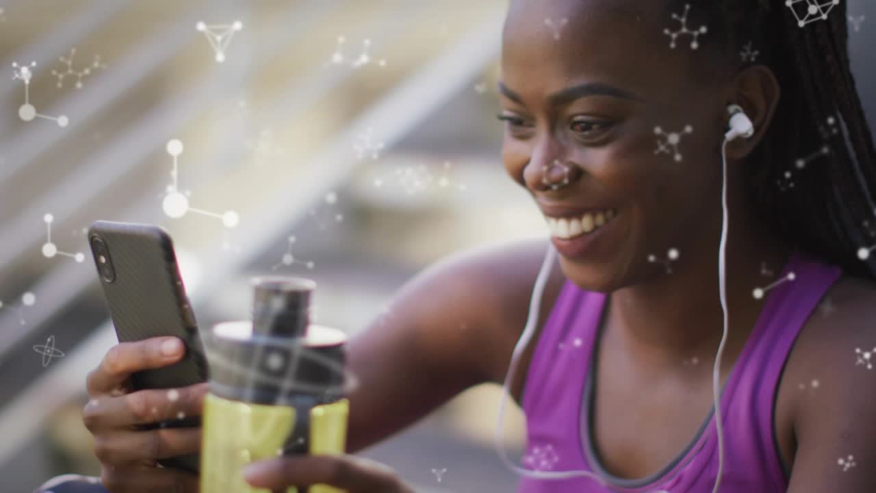 Woman on stairs holding yellow bottle and phone, bringing near, viewing fitness, molecules overlay