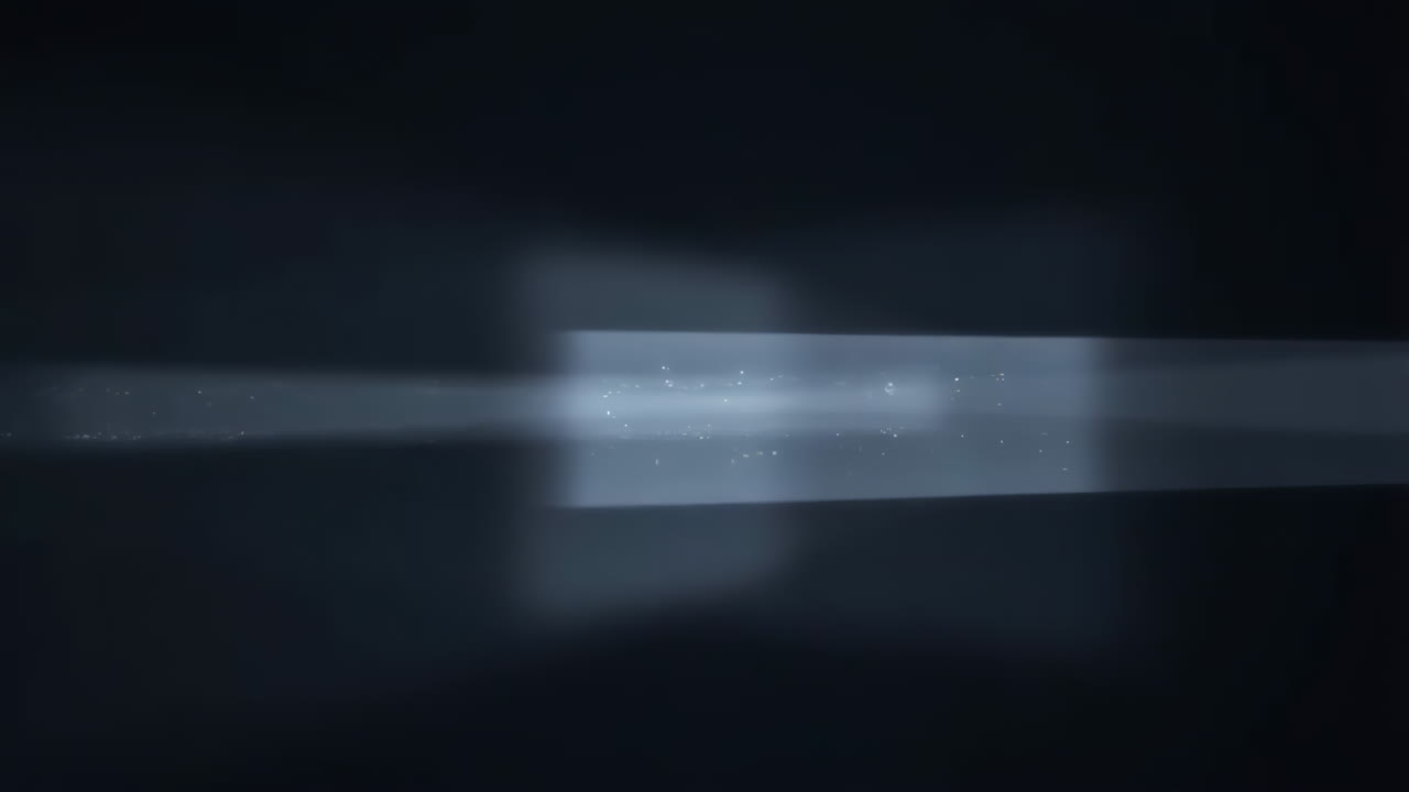 Abstract Light Streak with Glowing Particles on Dark Background