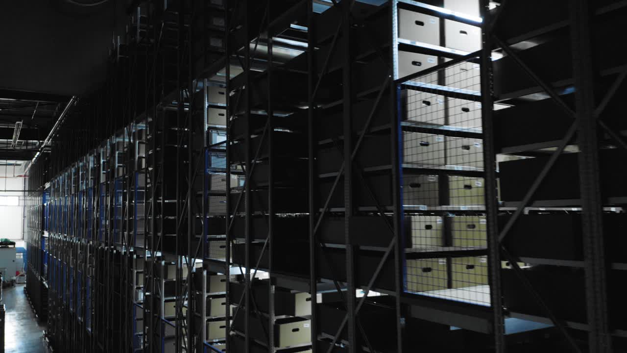 Drone shows storage space on multi-storey shelving systems of big warehouse