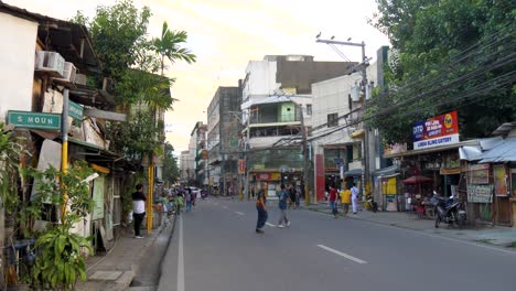 daytime traffic on busy street in city of cebu, philippines. wide shot