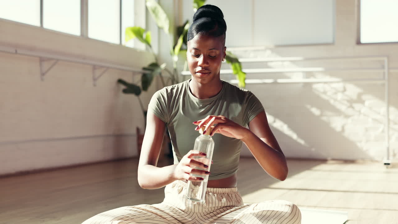 Woman Drinking Water in a Bright Room