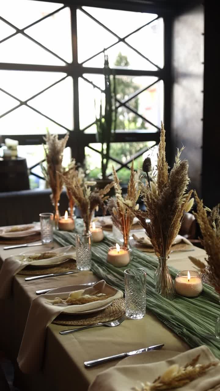 Elegant Dining Table Setting with Pampas Grass and Candles