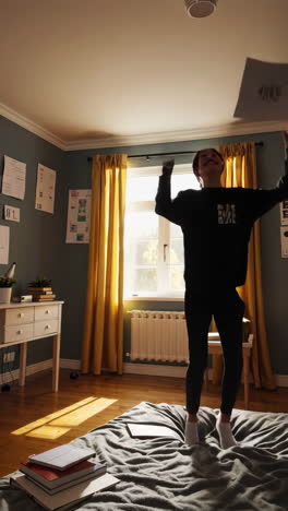 happy person jumping in a bedroom