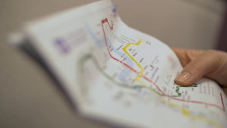 Woman-with-metro-map-in-the-train