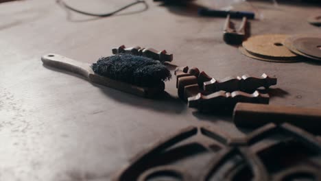 metalworking tools and materials on workshop table