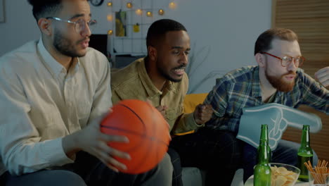 friends watching basketball game