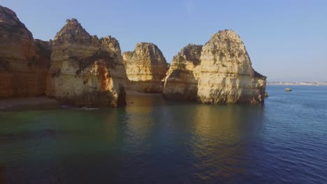 The-famous-cliffs-and-caves-of-Farol-da-Ponta-da-Piedade-in-Lagos,-Portugal