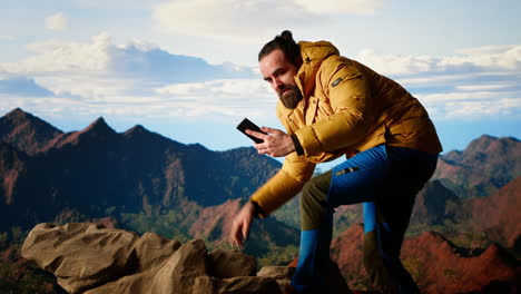 reckless trekker risking his life focusing on his phone and falling