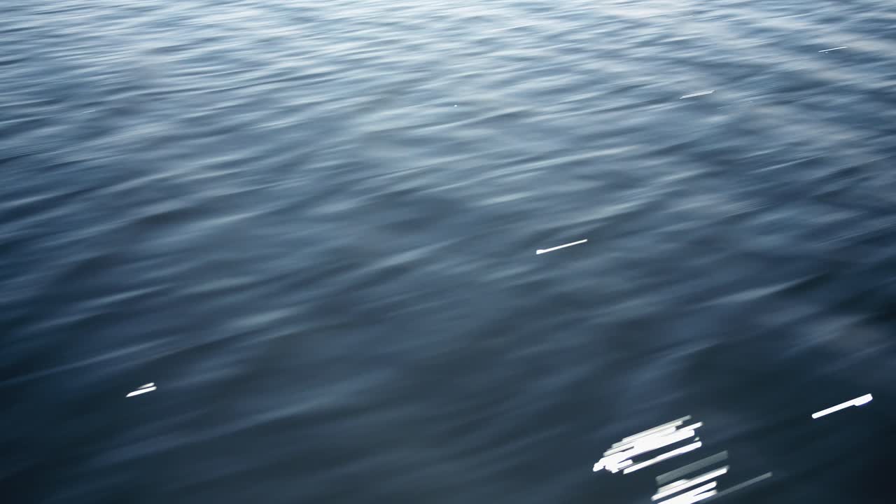 Minimalist motion of clear water waves shimmering softly, perfect for ocean, lake, or ambient video projects