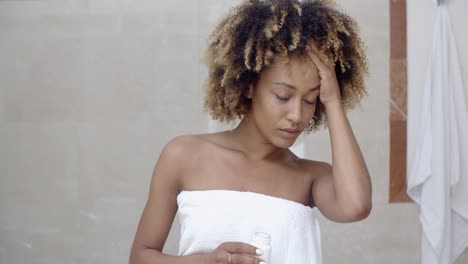 young woman taking pills