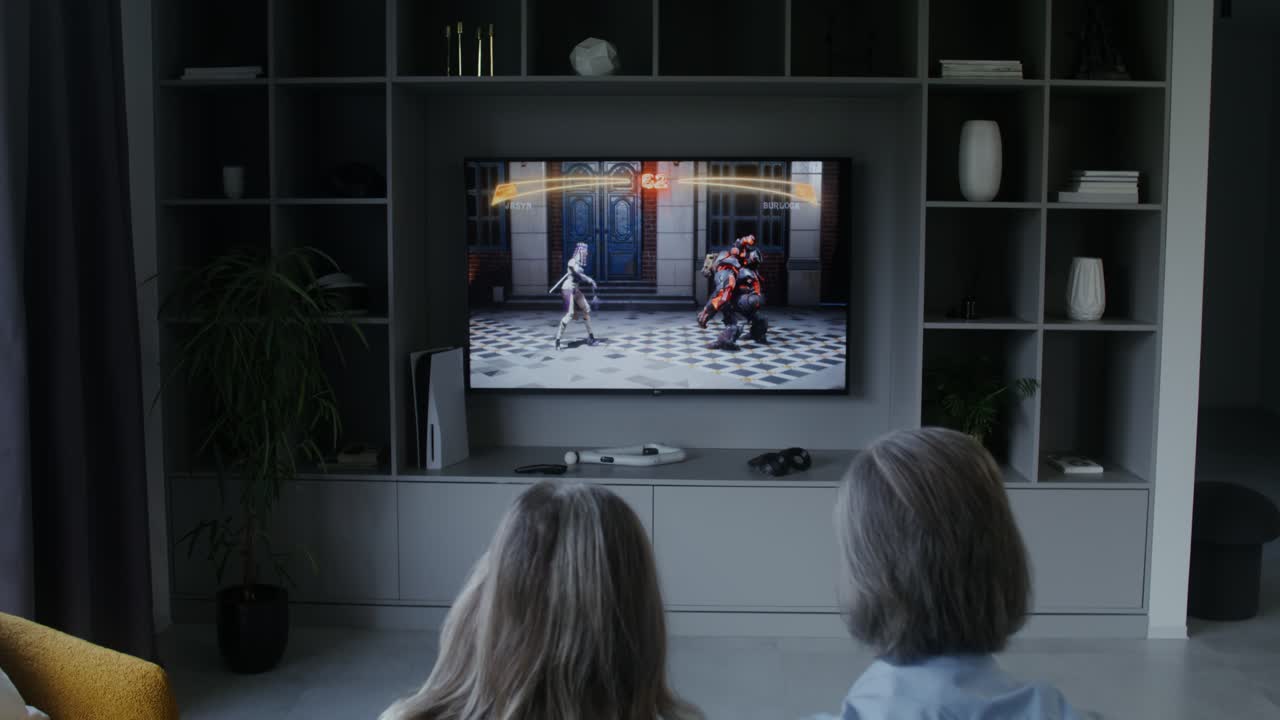 People playing video game on TV