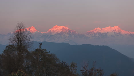 golden hour-evening timelapse of sun-rays leaving the annapurna mountain range as seen from ghan-pokhara, lamjung, nepal