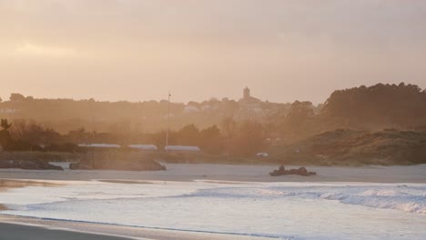 cinematic-slow-motion-shot-of-waves-arriving-in-a-bay-with-a-magical-mist-over-the-water