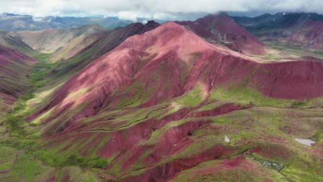 Aerial-fly-drone-view-of-Rainbow-Mountain-,-Vinicunca,-Cusco-Region,-Peru