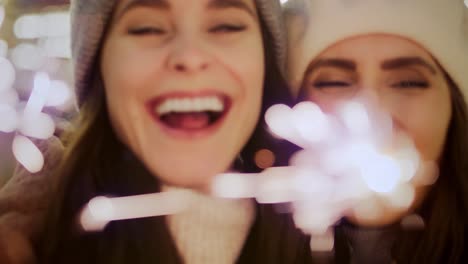 Handheld-video-of--friends-with-sparklers-on-Christmas-market