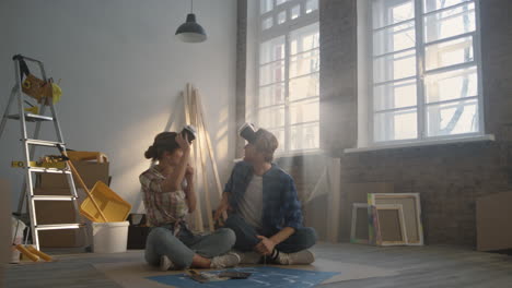 Happy-family-using-vr-glasses-indoors.-Couple-discussing-house-redesign.