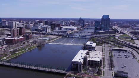 grand river, grand rapids skyline and distant horizon, wide aerial pan