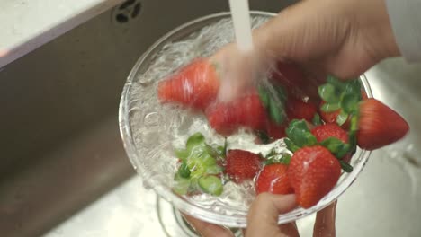 washing strawberries