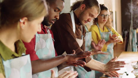 chef and students rubbing spices during cooking class