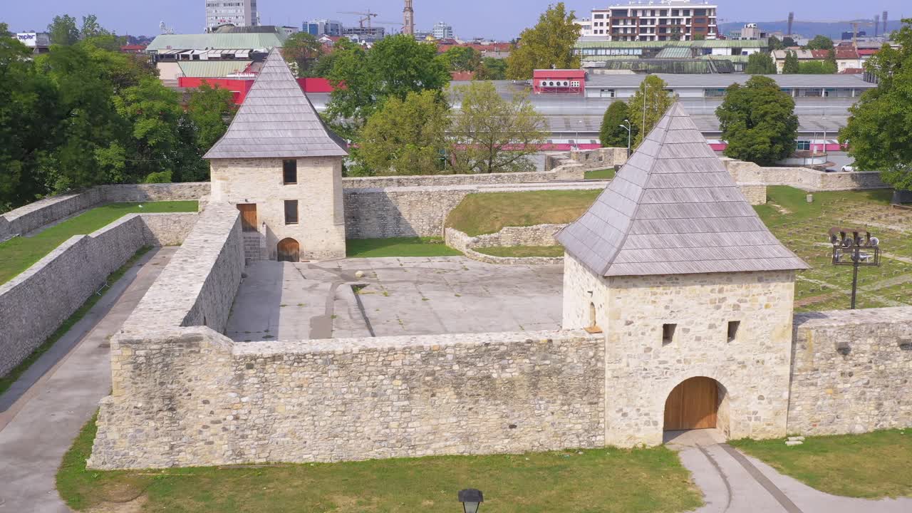 Fortified white stone towers and thick walls of castle, Bosnia and Herzegovina, aerial