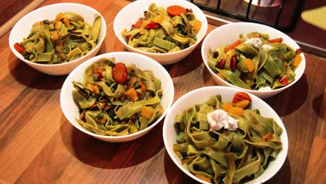 finishing touches on the fried green spinach egg pasta