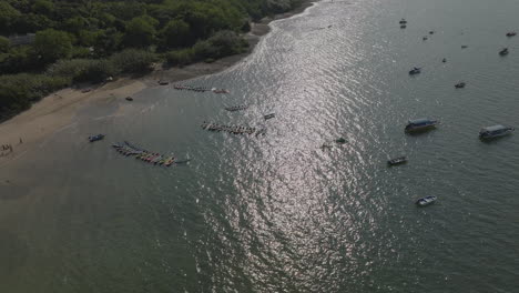 Aerial-Drone-shot-of-boats-floating-in-Hong-Kong-waters,-China