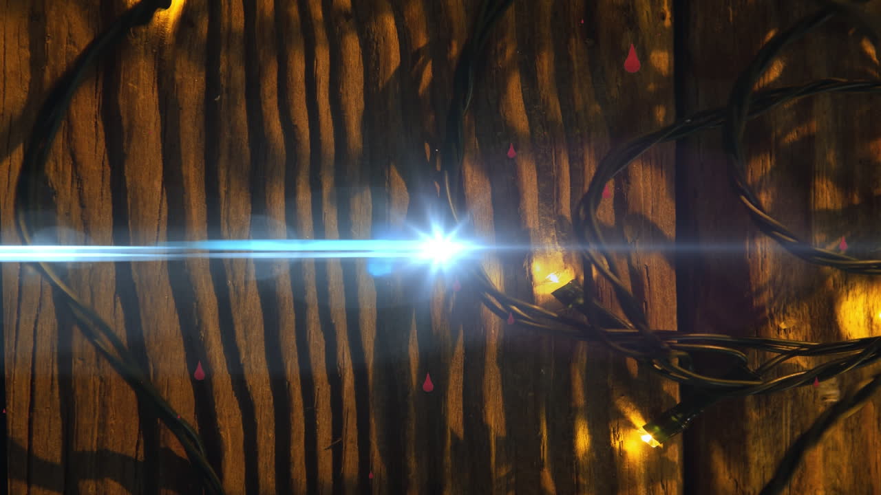 animación de senderos de luz y gotas sobre luces de hadas en navidad