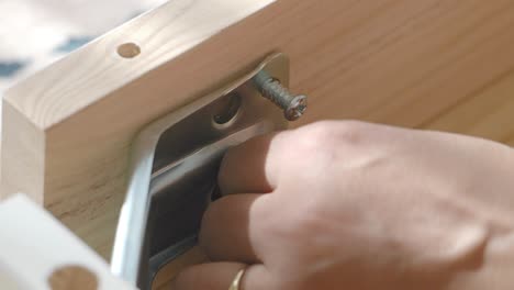 assembling wooden furniture with metal brackets